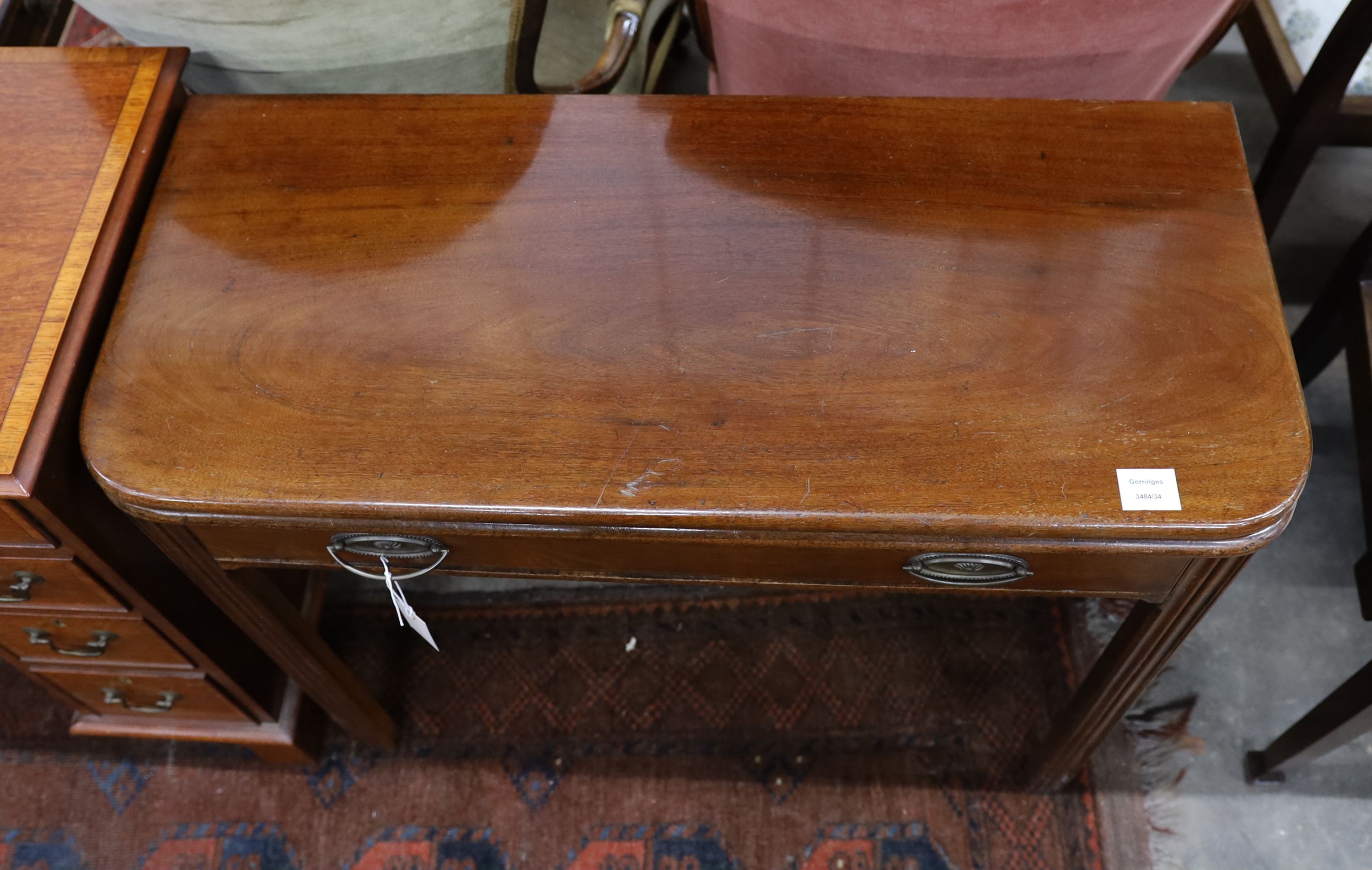 A George III rectangular mahogany folding tea table, width 91cm, depth 40cm, height 74cm